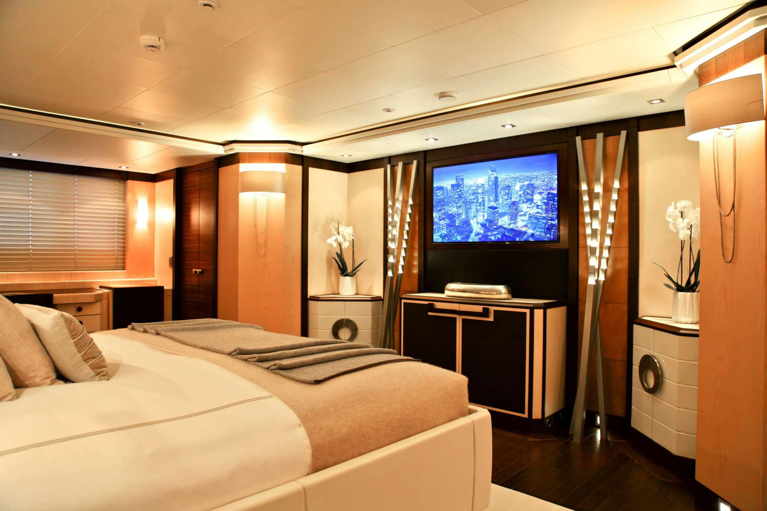 a room with a bed and a tv on the wall aboard ALALYA Yacht for Charter