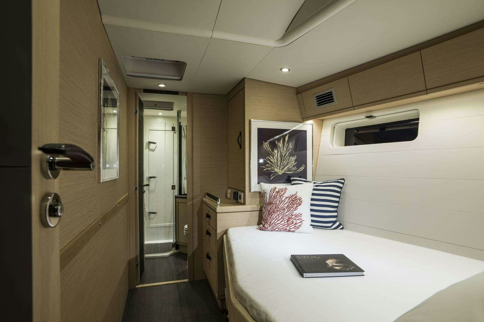 a hotel room with a bed aboard THEA Yacht for Charter