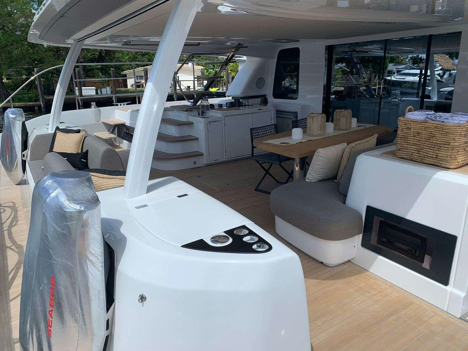 a room with a table and chairs aboard C’EST LA VIE Yacht for Charter