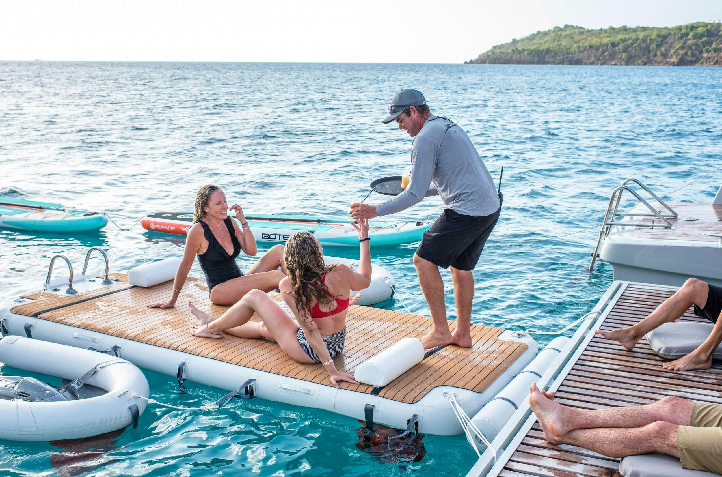 a group of people in a boat aboard C’EST LA VIE Yacht for Charter