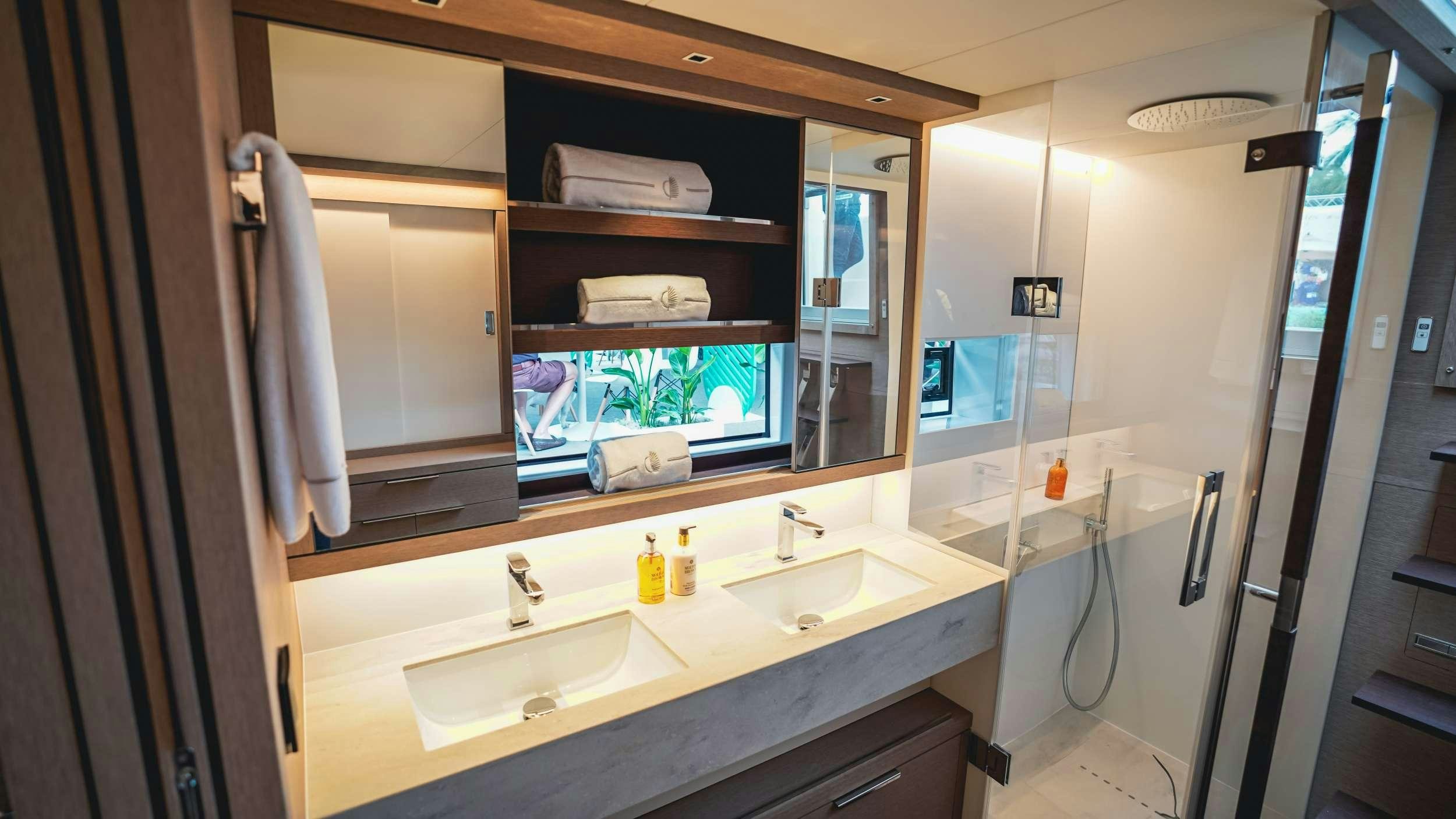 a bathroom with two sinks aboard C’EST LA VIE Yacht for Charter
