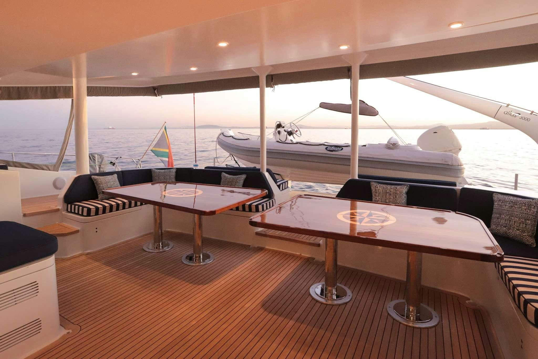 a room with a table and chairs aboard SKIMMER Yacht for Charter
