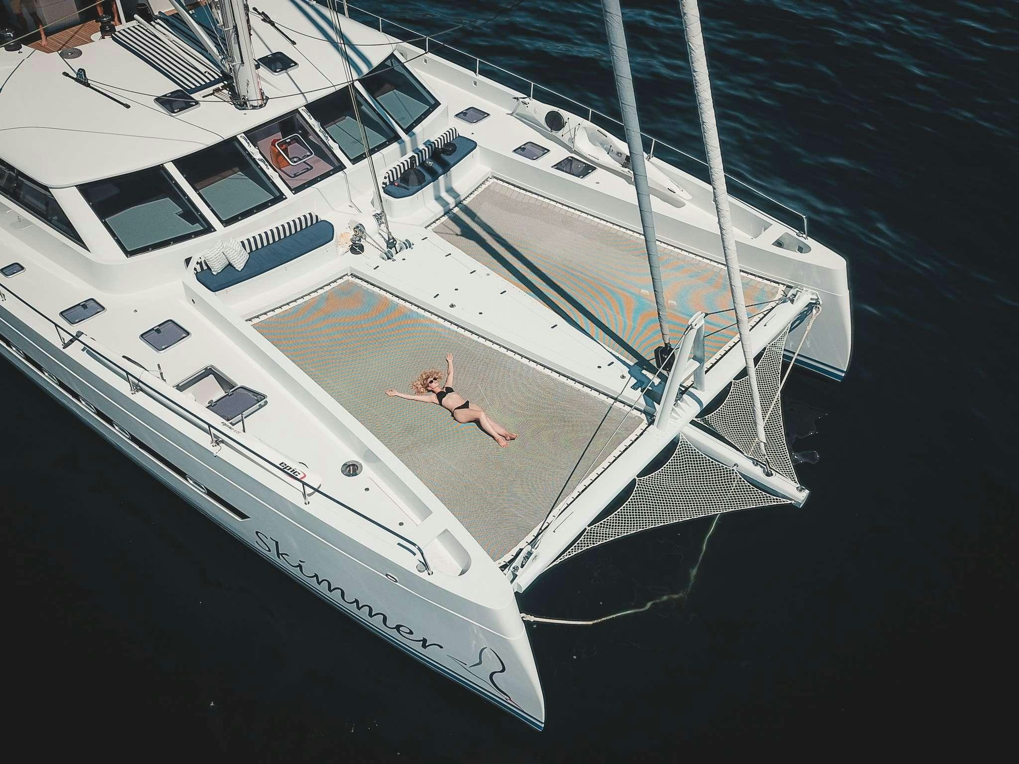 a person lying on a boat aboard SKIMMER Yacht for Charter