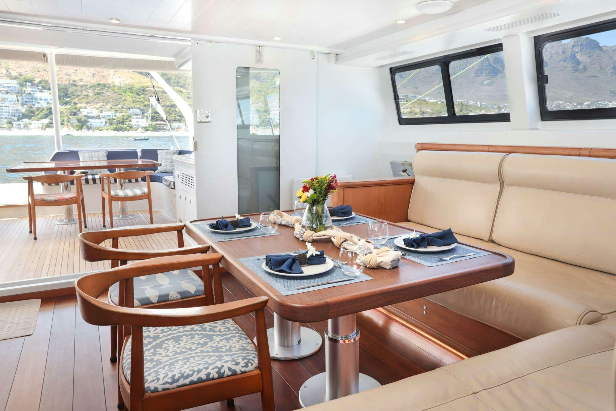 a dining room with a table and chairs aboard SKIMMER Yacht for Charter