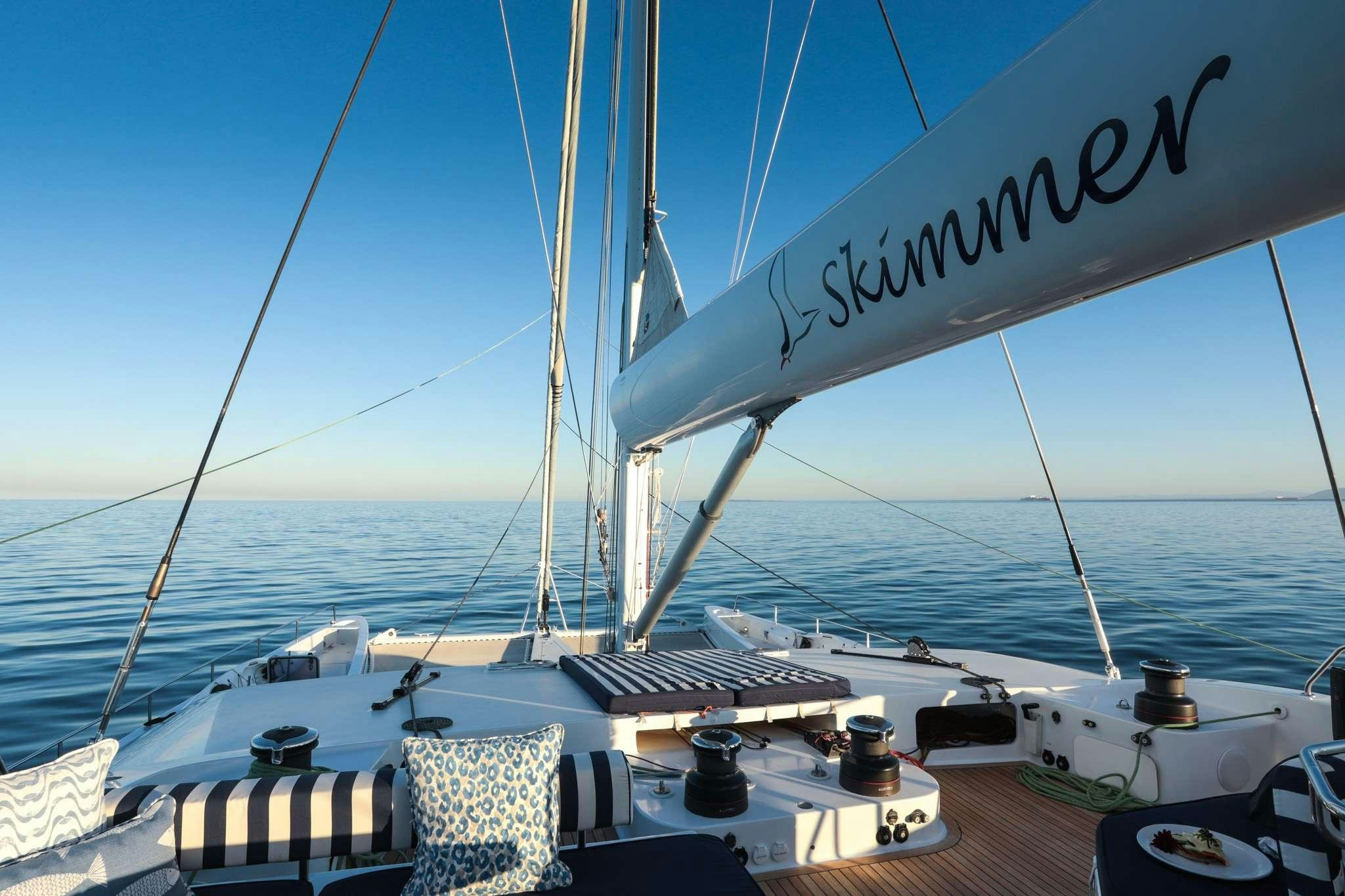 a large sailboat on the water aboard SKIMMER Yacht for Charter