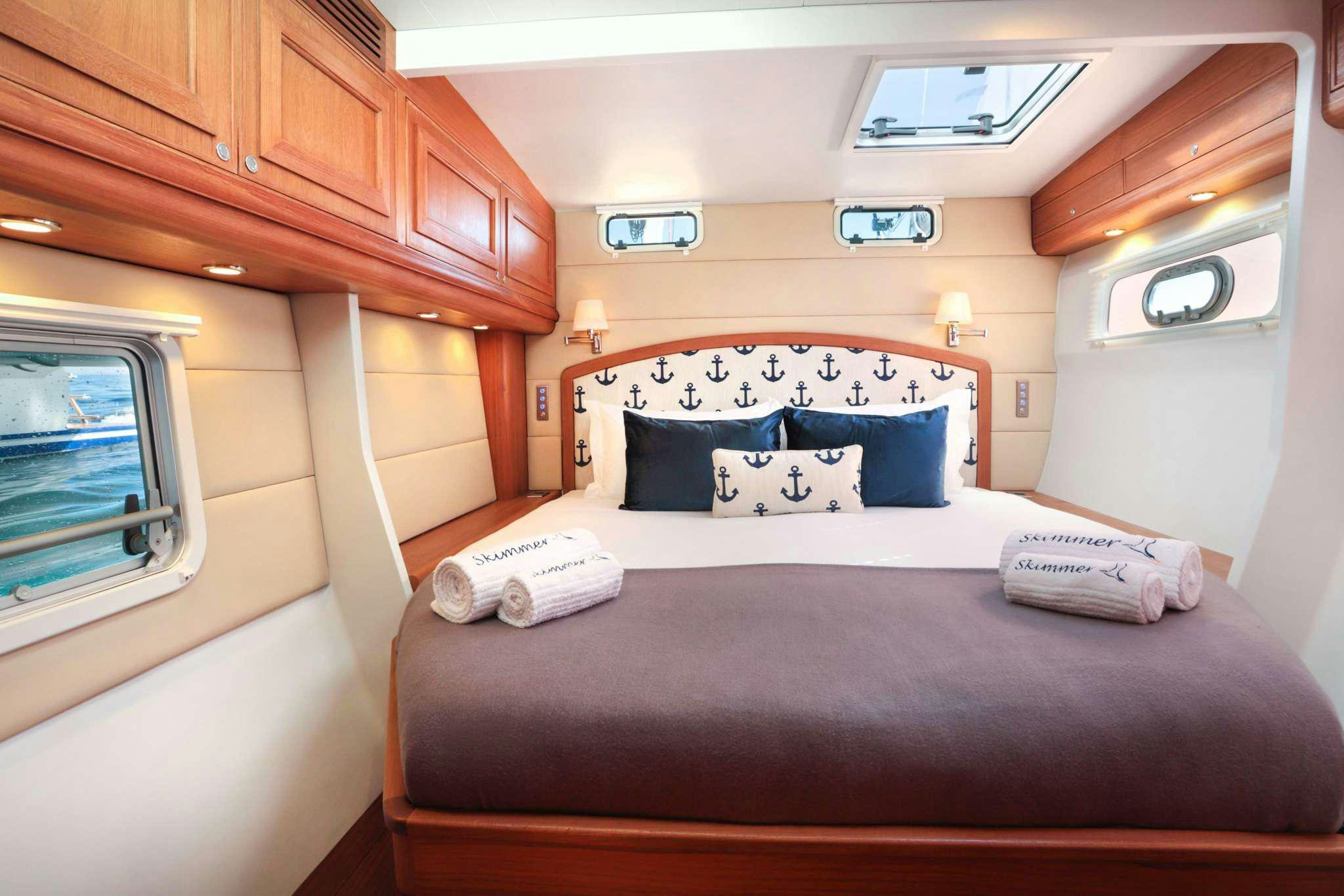 a bed in a cabin aboard SKIMMER Yacht for Charter