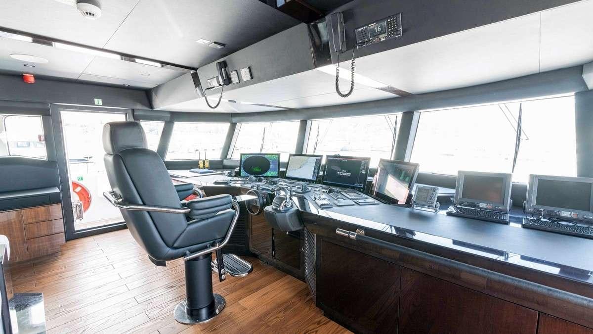 a room with computers and monitors aboard LADY CAROLINE Yacht for Charter