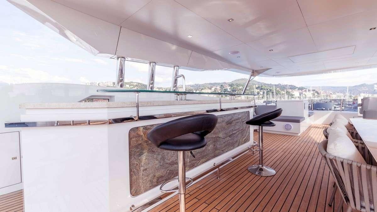 a room with a table and chairs aboard LADY CAROLINE Yacht for Charter