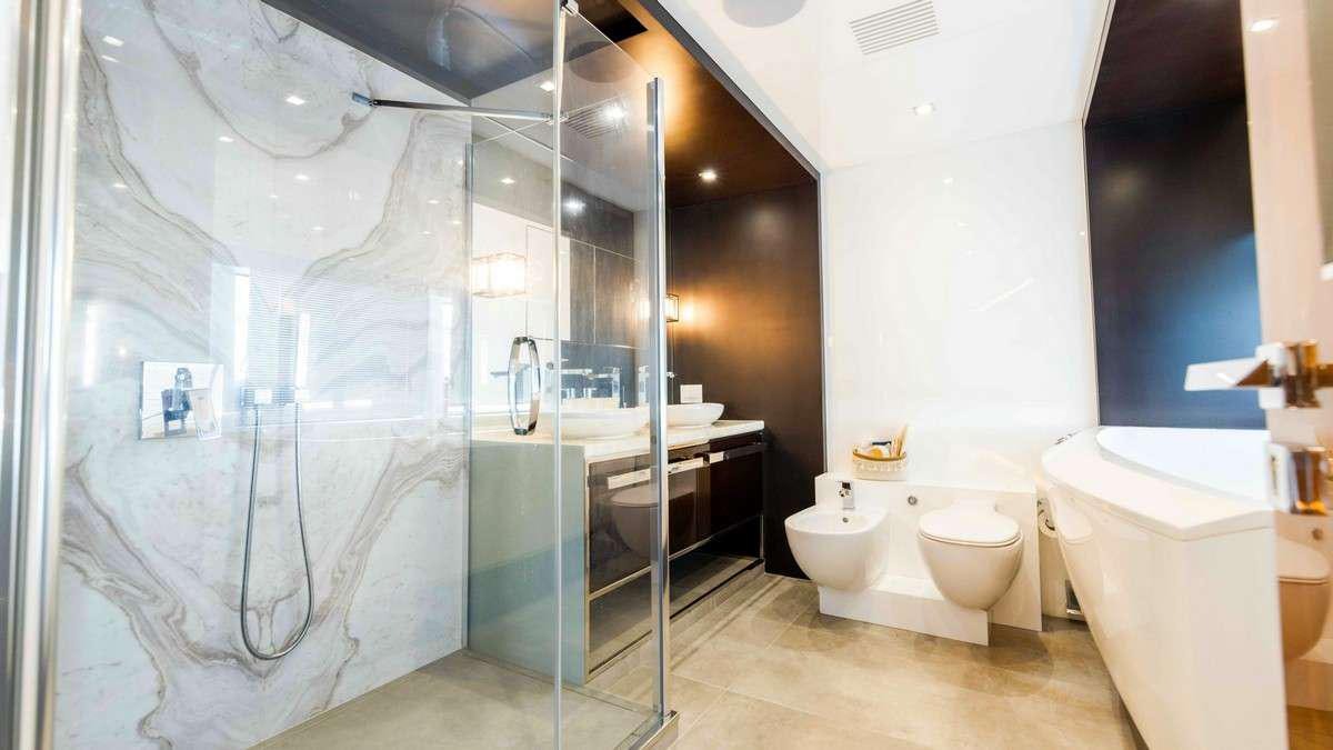 a bathroom with a glass shower aboard LADY CAROLINE Yacht for Charter