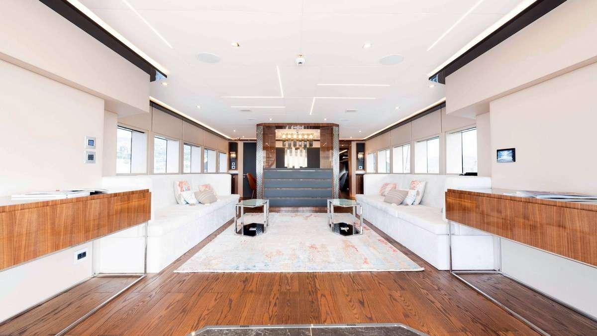 a room with a bed and a couch aboard LADY CAROLINE Yacht for Charter