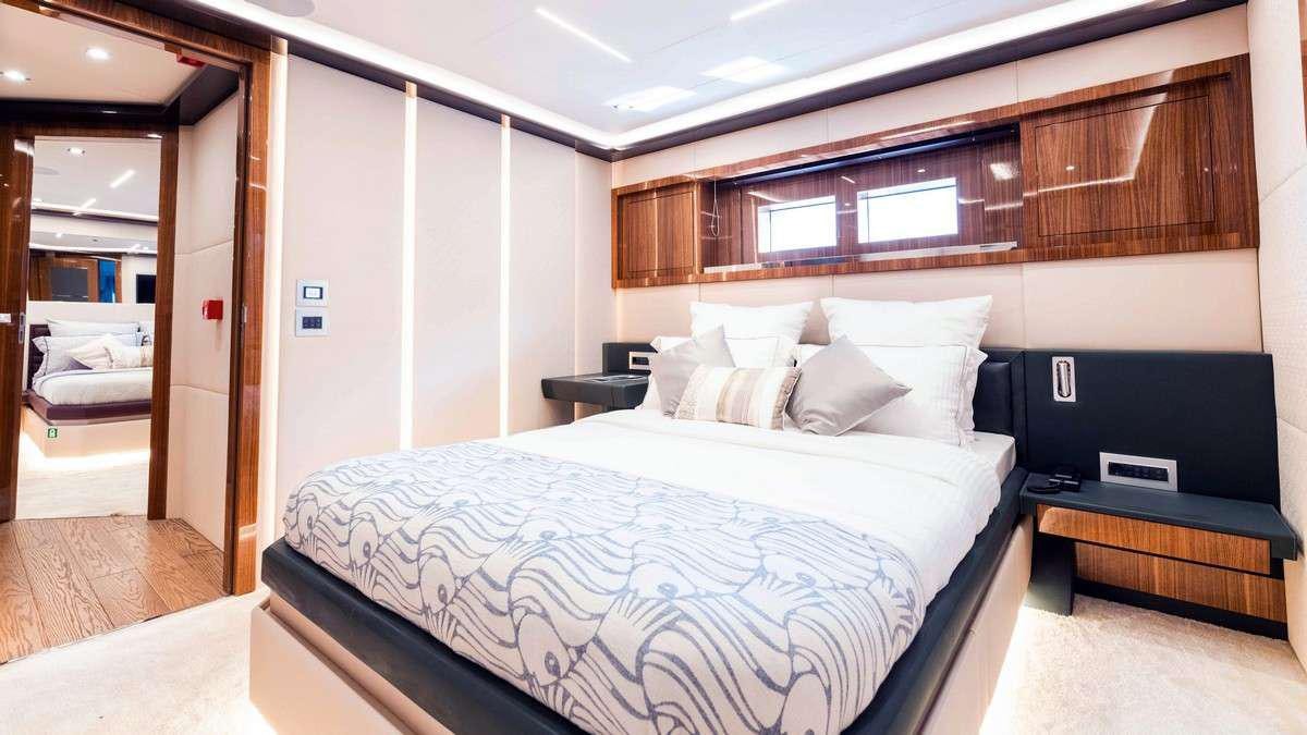 a large bed in a room aboard LADY CAROLINE Yacht for Charter