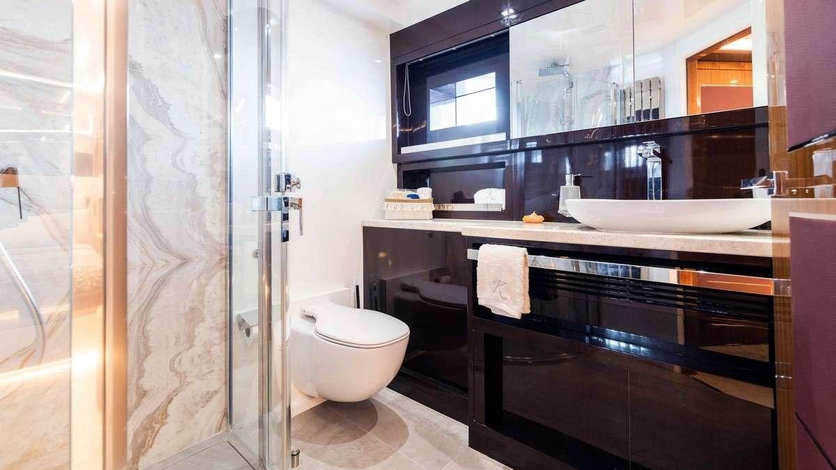 a bathroom with a tub sink and toilet aboard LADY CAROLINE Yacht for Charter