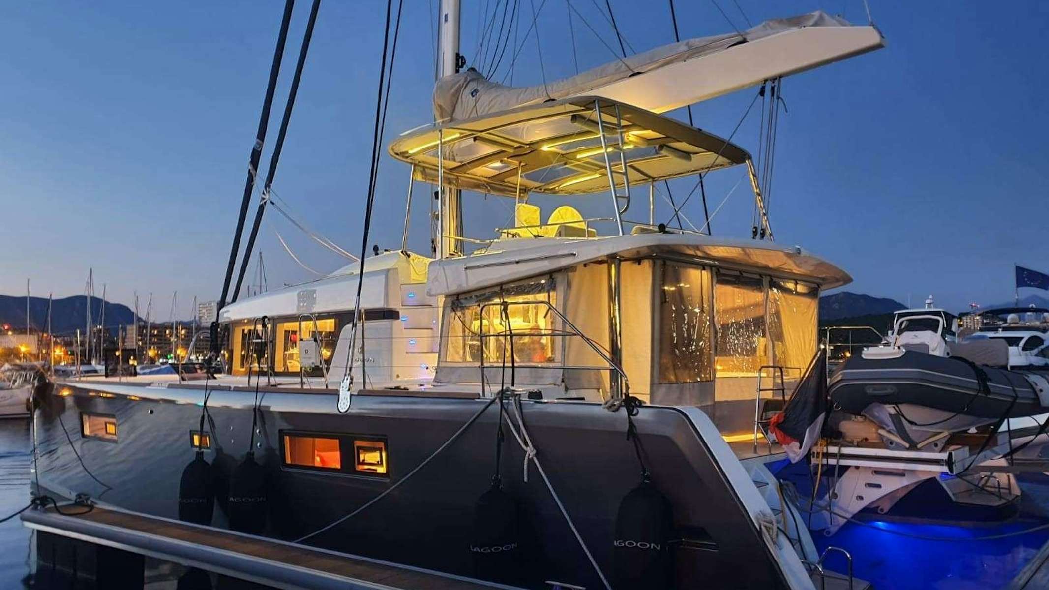 a boat docked at a pier aboard VIGILANT 2 Yacht for Charter