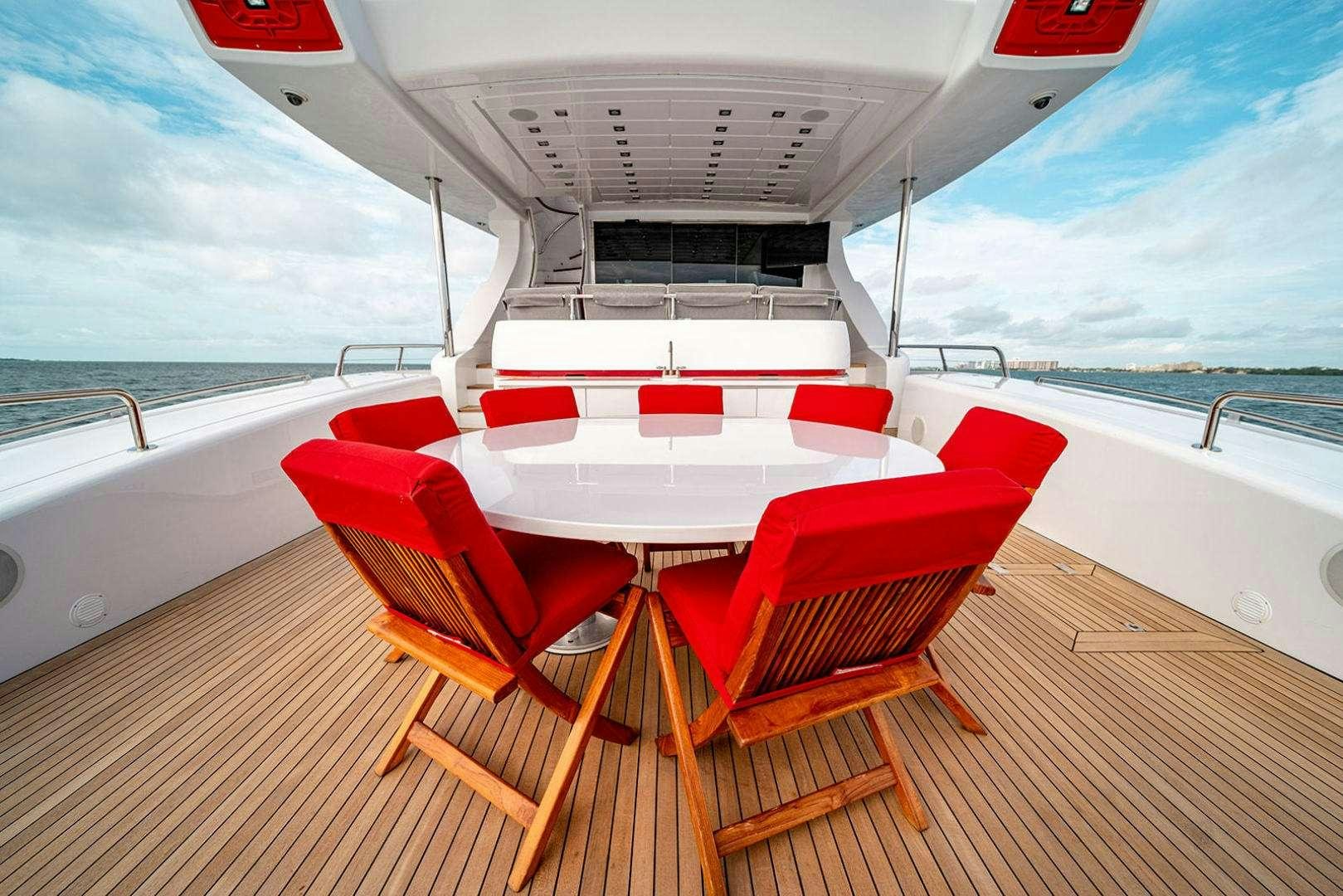 a boat with red seats on a deck aboard HARMONIC WAVES Yacht for Charter
