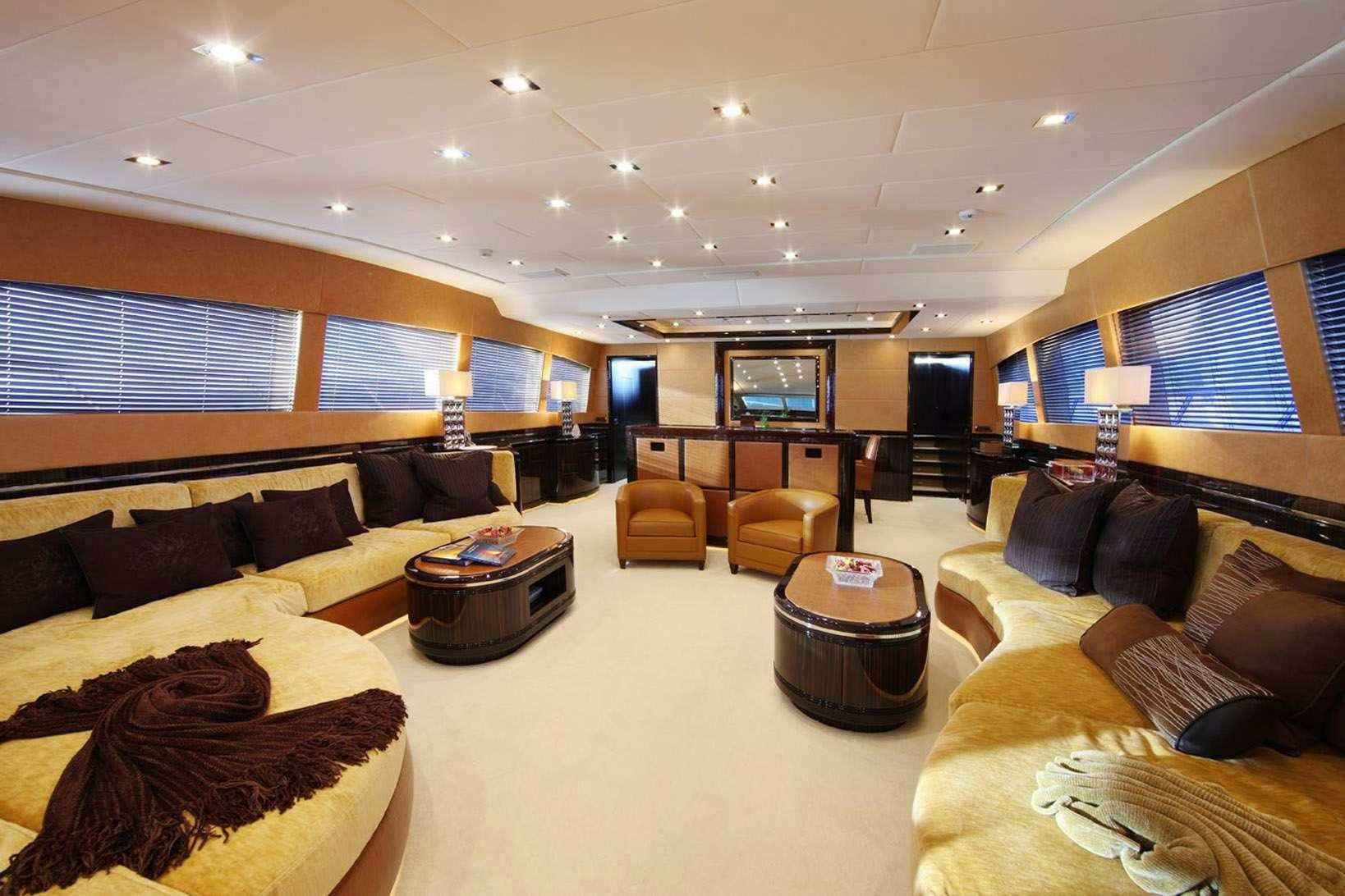 a living room with a large window aboard HARMONIC WAVES Yacht for Charter