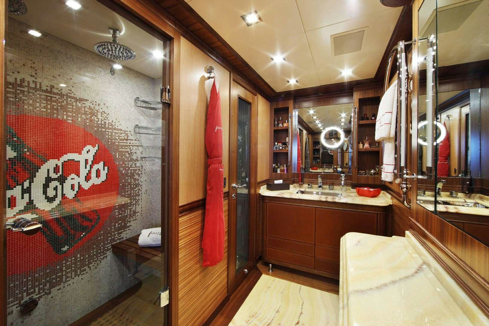 a bathroom with a large mirror aboard HARMONIC WAVES Yacht for Charter