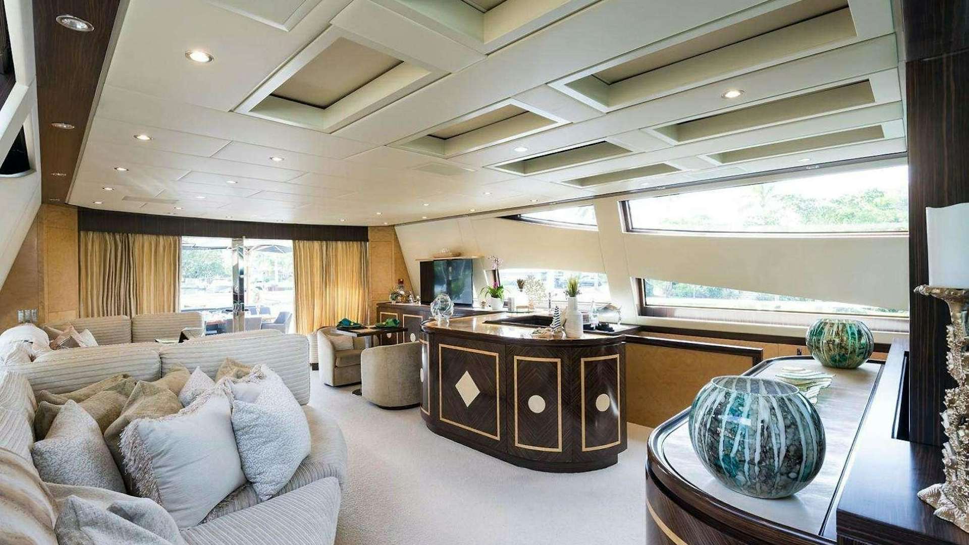 a living room with a large window aboard ENCORE Yacht for Charter