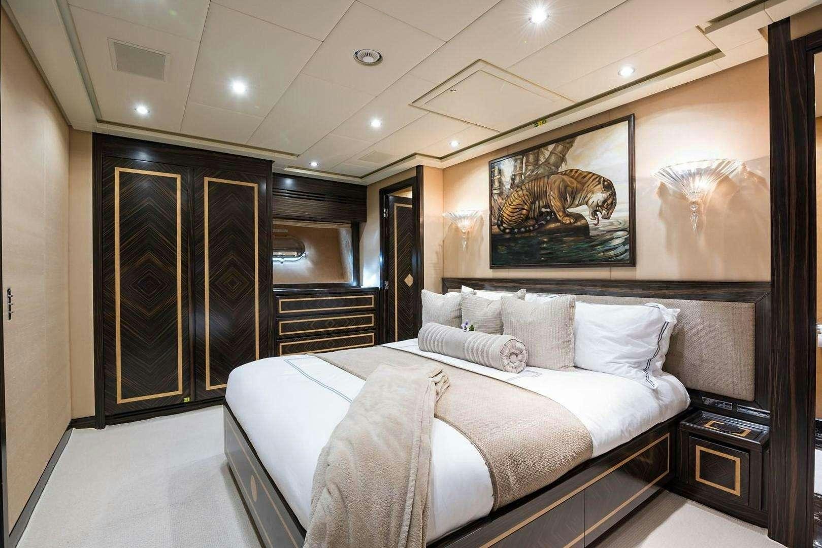 a bed in a room aboard ENCORE Yacht for Charter