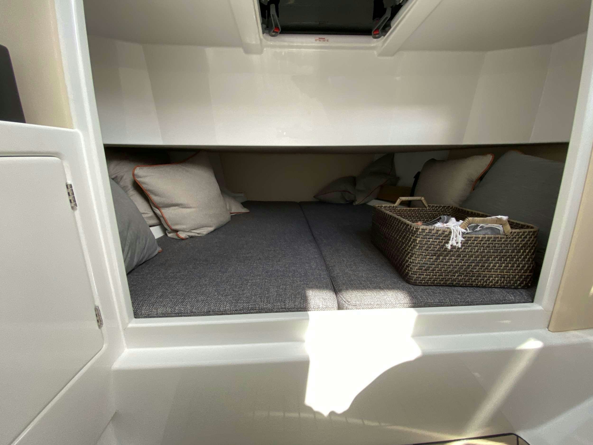 a cat sleeping on a rug in a car aboard Money Penny  Yacht for Charter