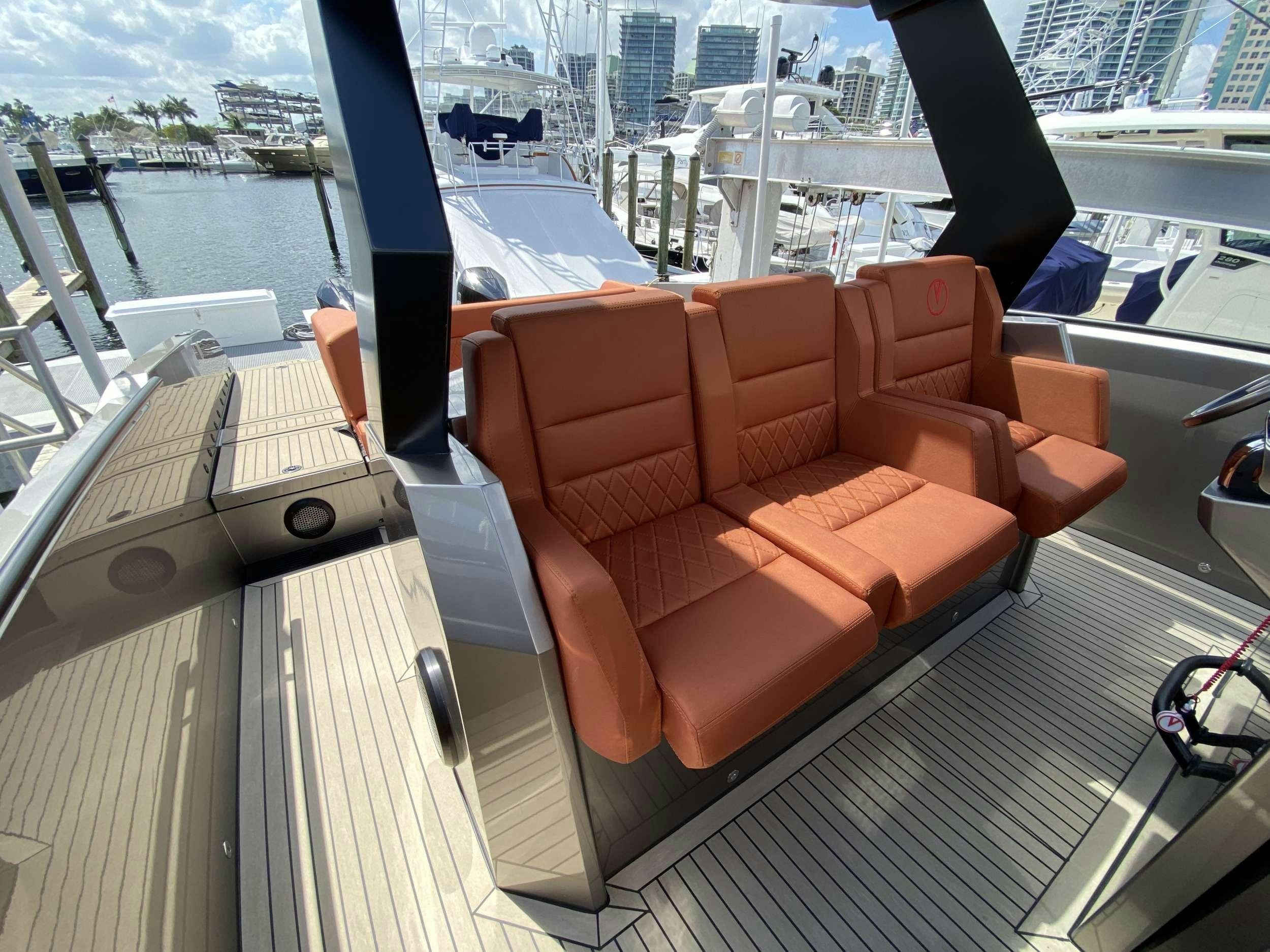 a couch on a deck aboard Money Penny  Yacht for Charter