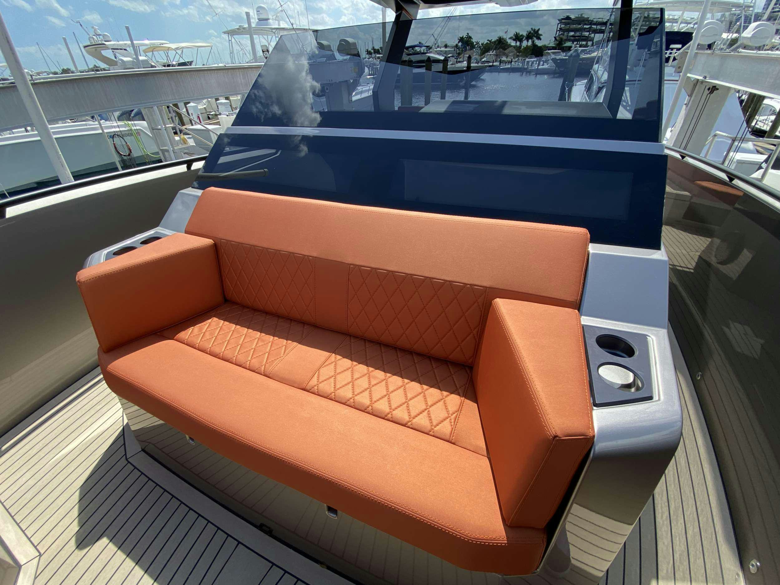 an orange couch on a boat aboard Money Penny  Yacht for Charter