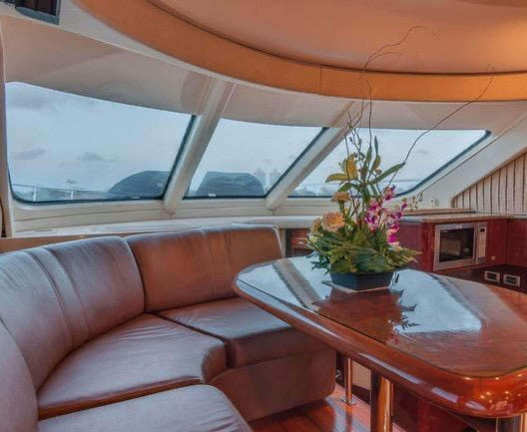 a flower pot on a table aboard Champagne  Yacht for Charter