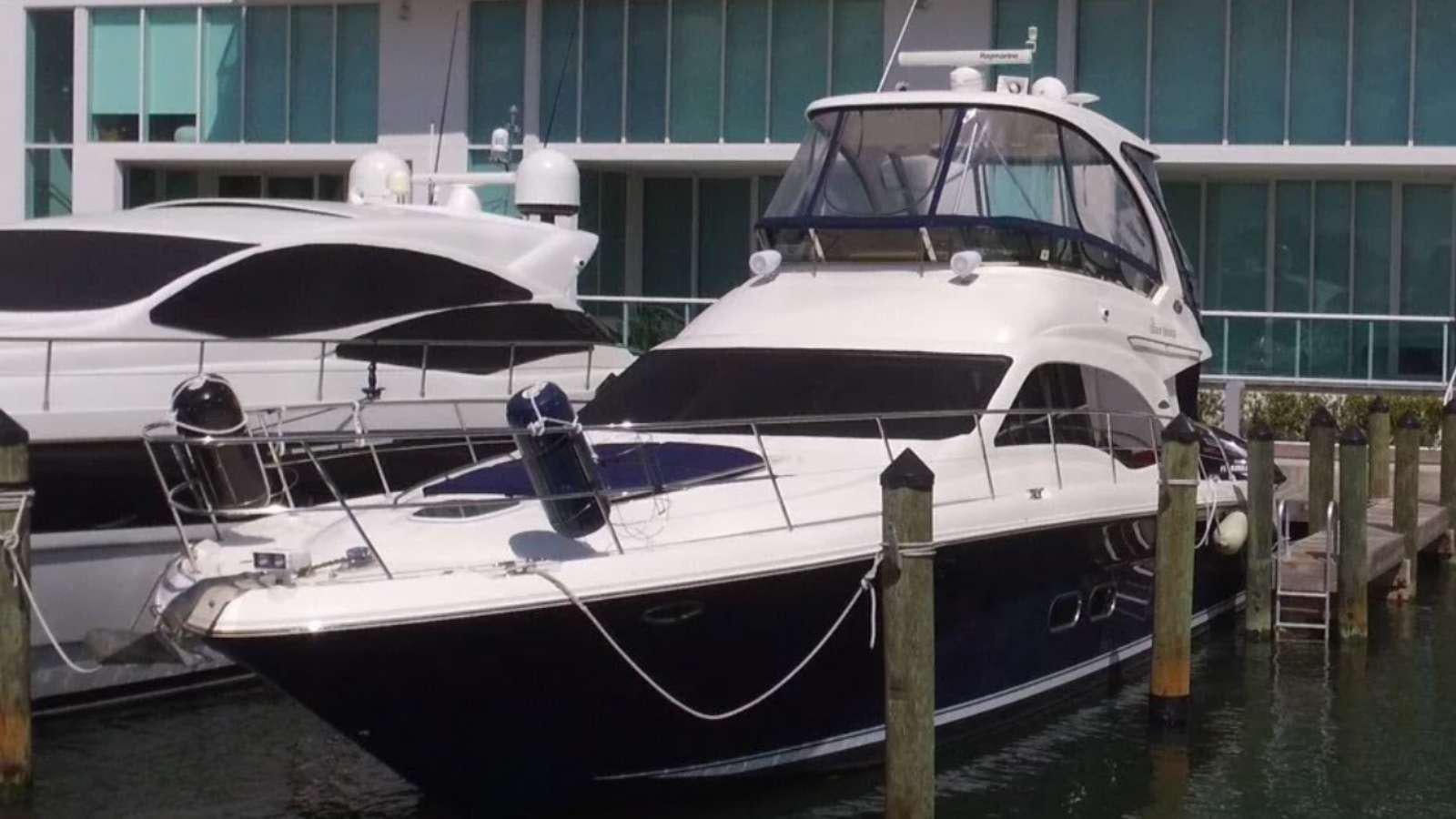 a boat docked at a pier aboard Champagne  Yacht for Charter