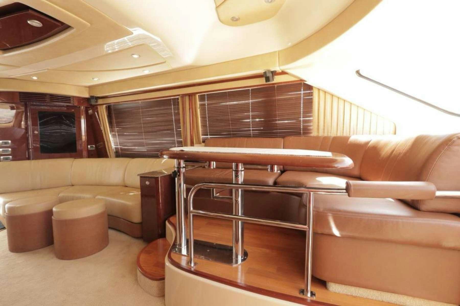 a room with a couch and a table aboard Champagne  Yacht for Charter