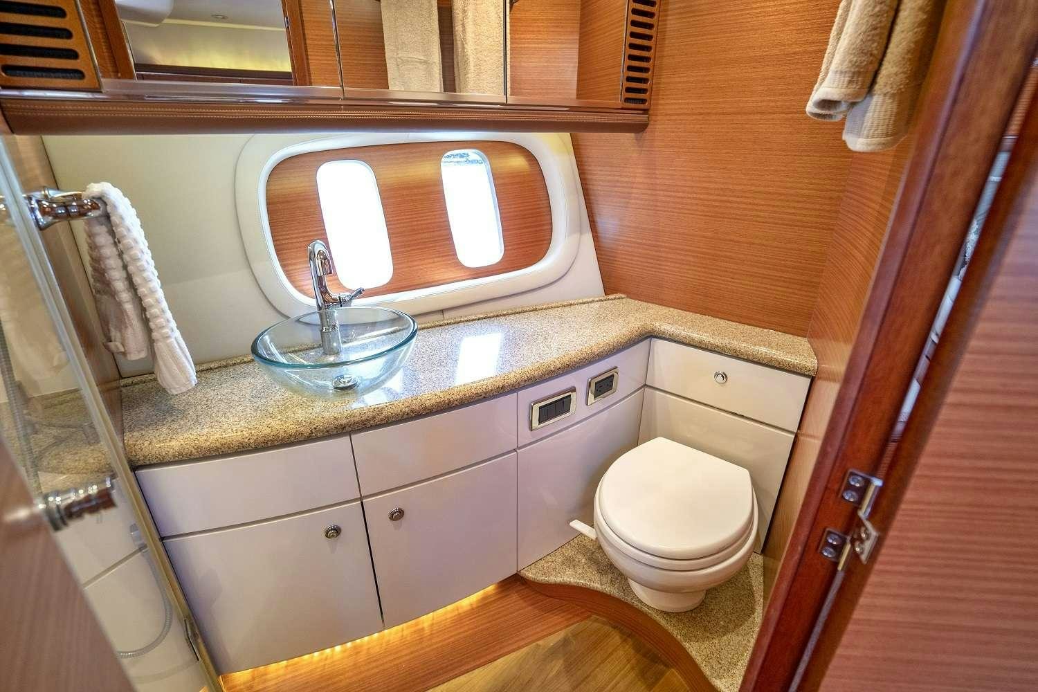a bathroom with a sink and toilet aboard GUCCI Yacht for Charter