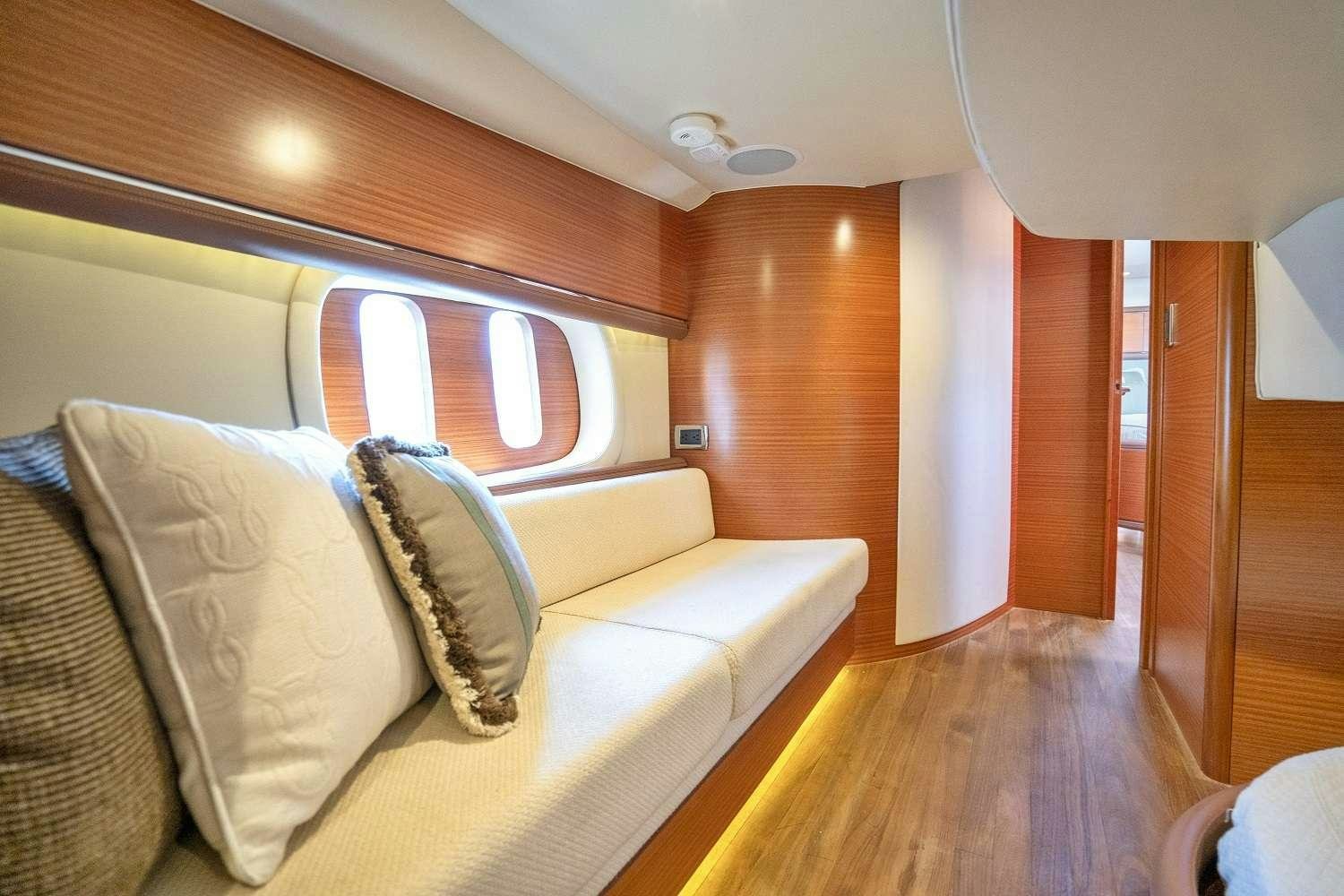a living room with a couch aboard GUCCI Yacht for Charter