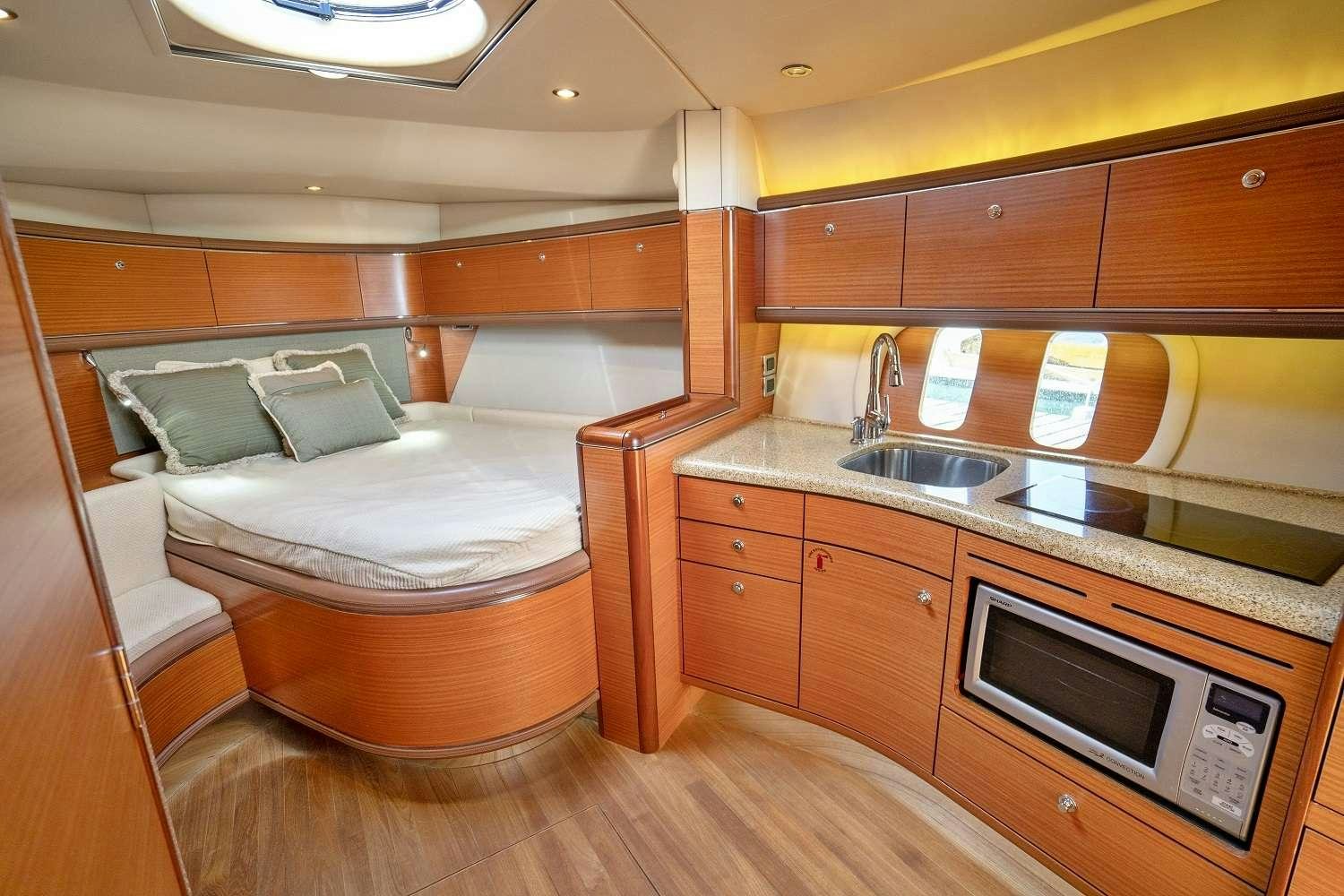a bathroom with a bed and a sink aboard GUCCI Yacht for Charter