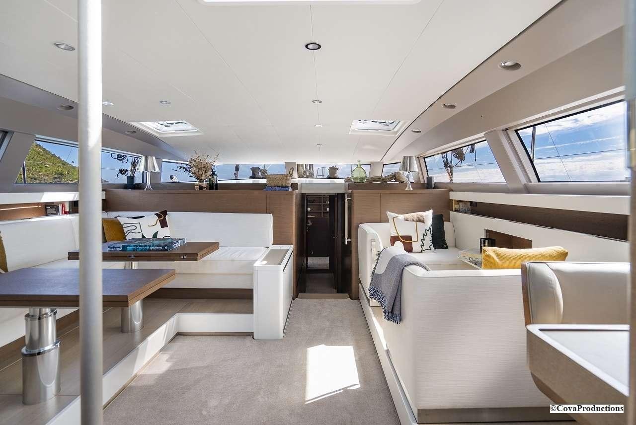 a room with a bed and desk aboard MAOYA Yacht for Charter