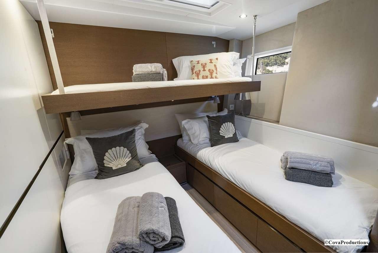 a room with two beds aboard MAOYA Yacht for Charter