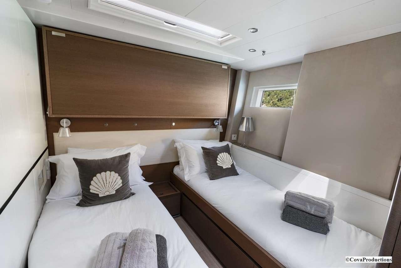 a room with two beds aboard MAOYA Yacht for Charter