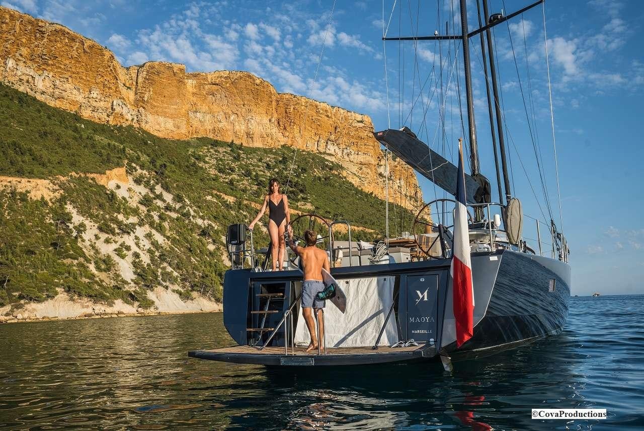 a couple of people on a boat aboard MAOYA Yacht for Charter