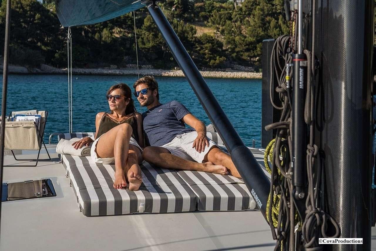 a couple sitting on a boat aboard MAOYA Yacht for Charter