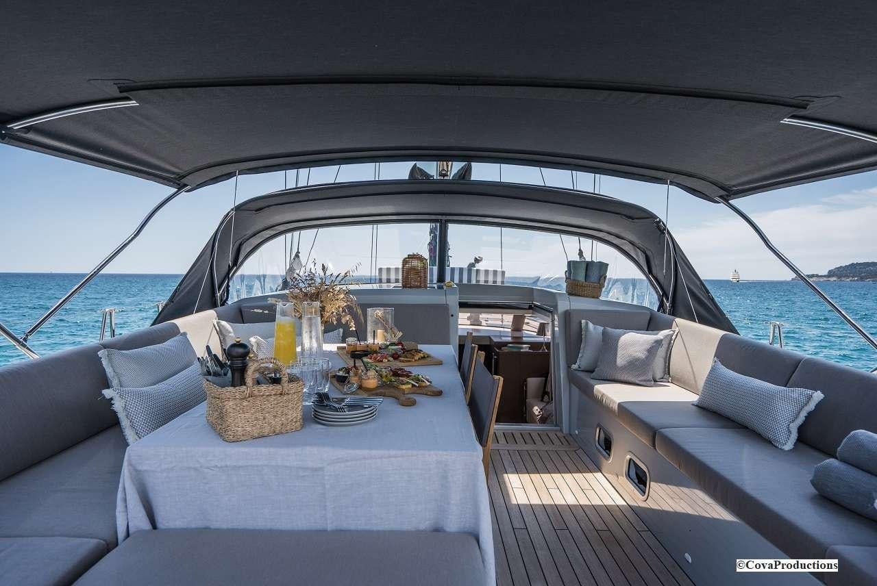 a boat with a table and chairs aboard MAOYA Yacht for Charter
