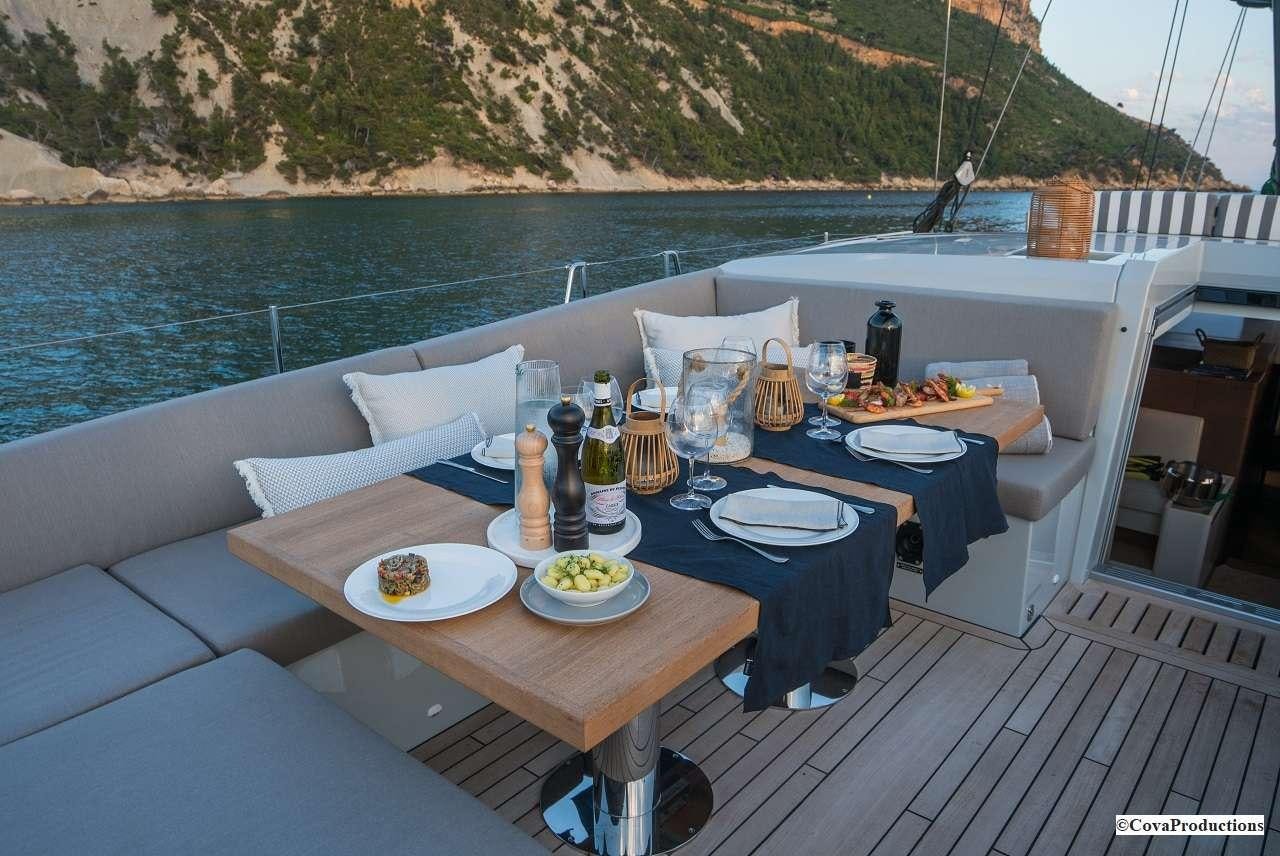a table with food on it aboard MAOYA Yacht for Charter