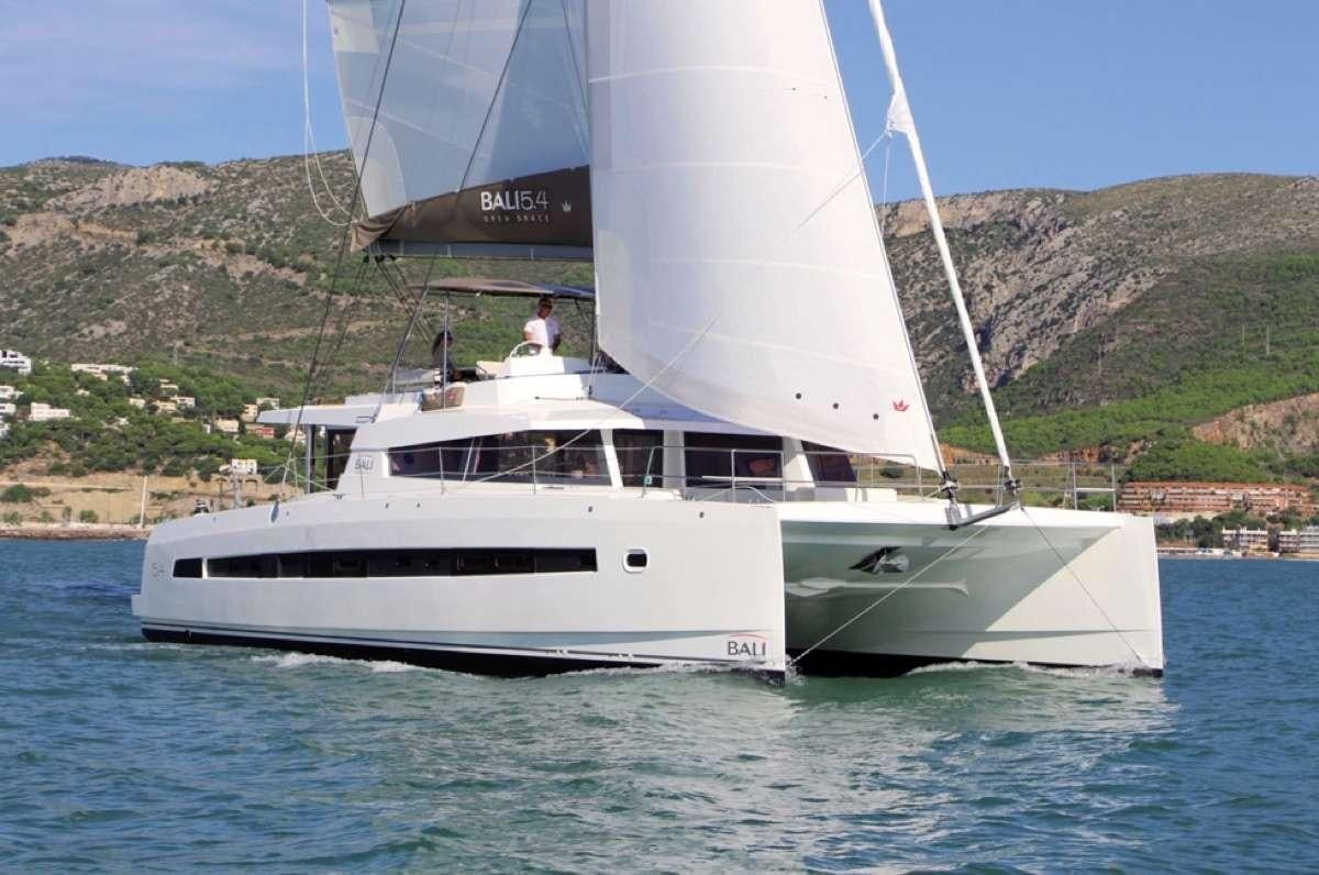 a white sailboat on the water aboard ATREYU Yacht for Charter