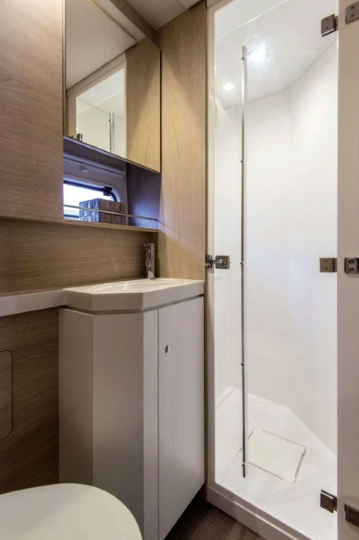 a bathroom with a sink and a toilet aboard ATREYU Yacht for Charter