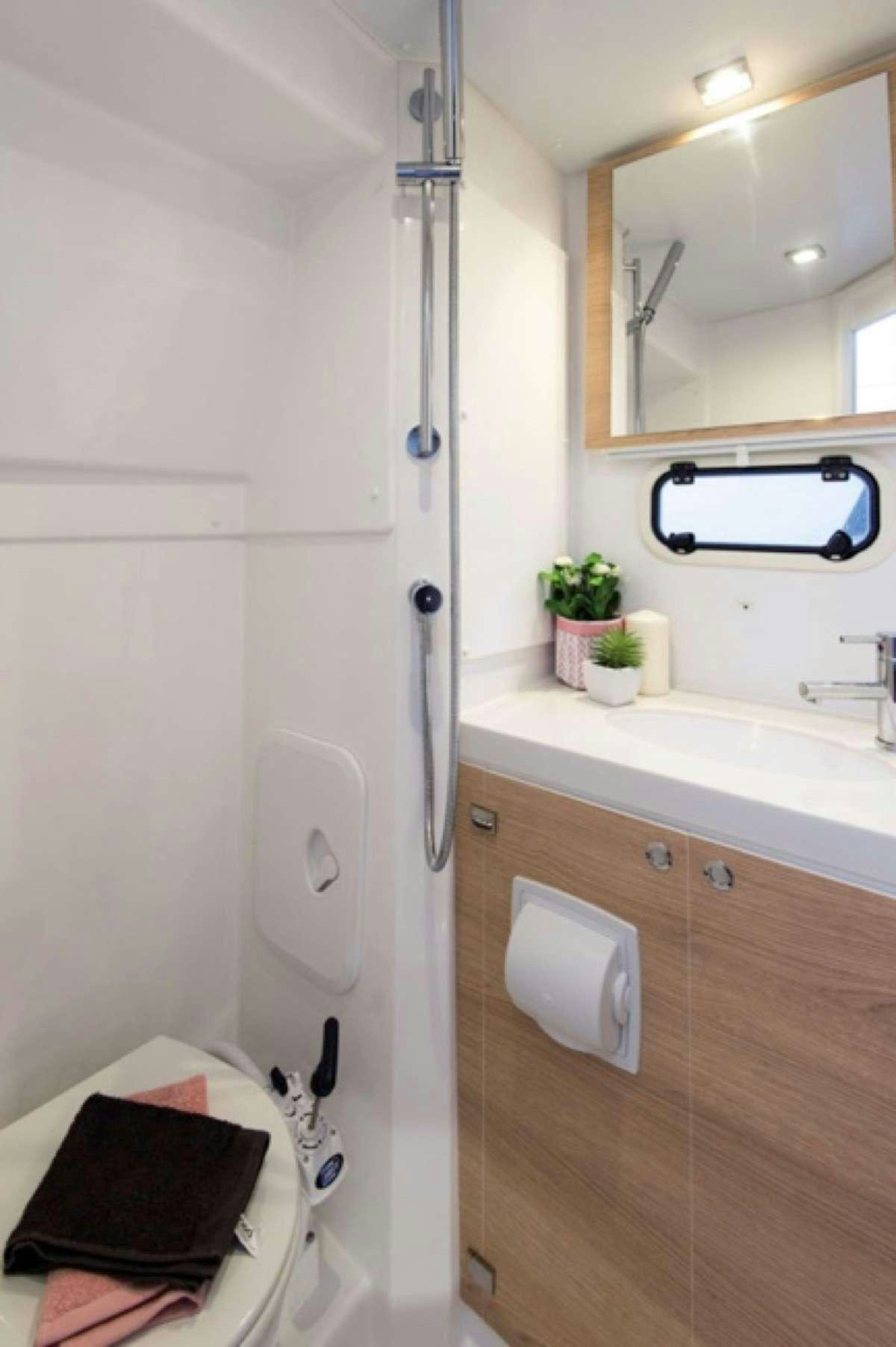 a bathroom with a sink and a mirror aboard ATREYU Yacht for Charter