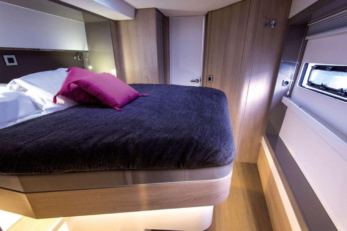a bed in a room aboard ATREYU Yacht for Charter
