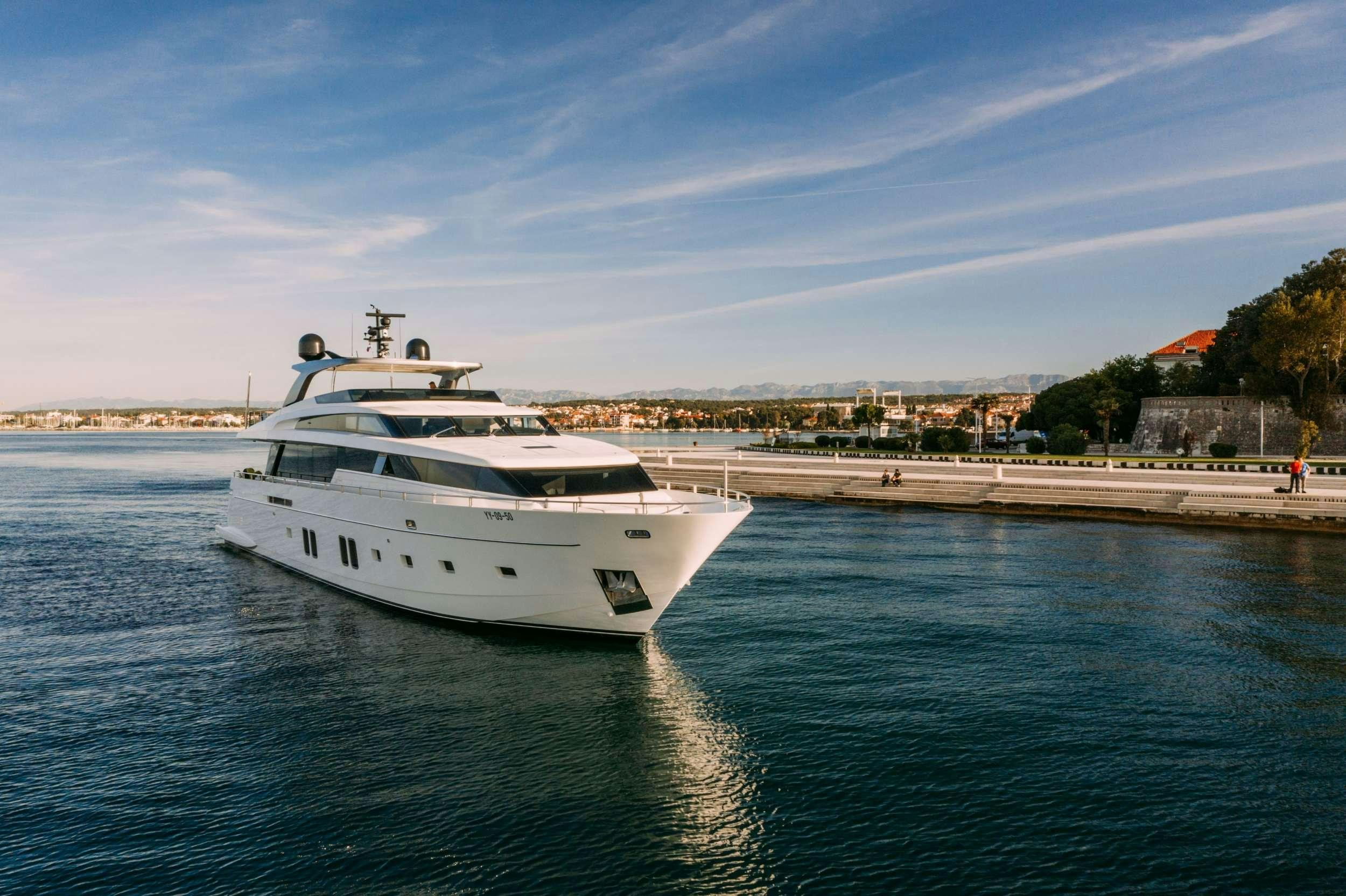 a white yacht on the water aboard ANDIAMO Yacht for Charter