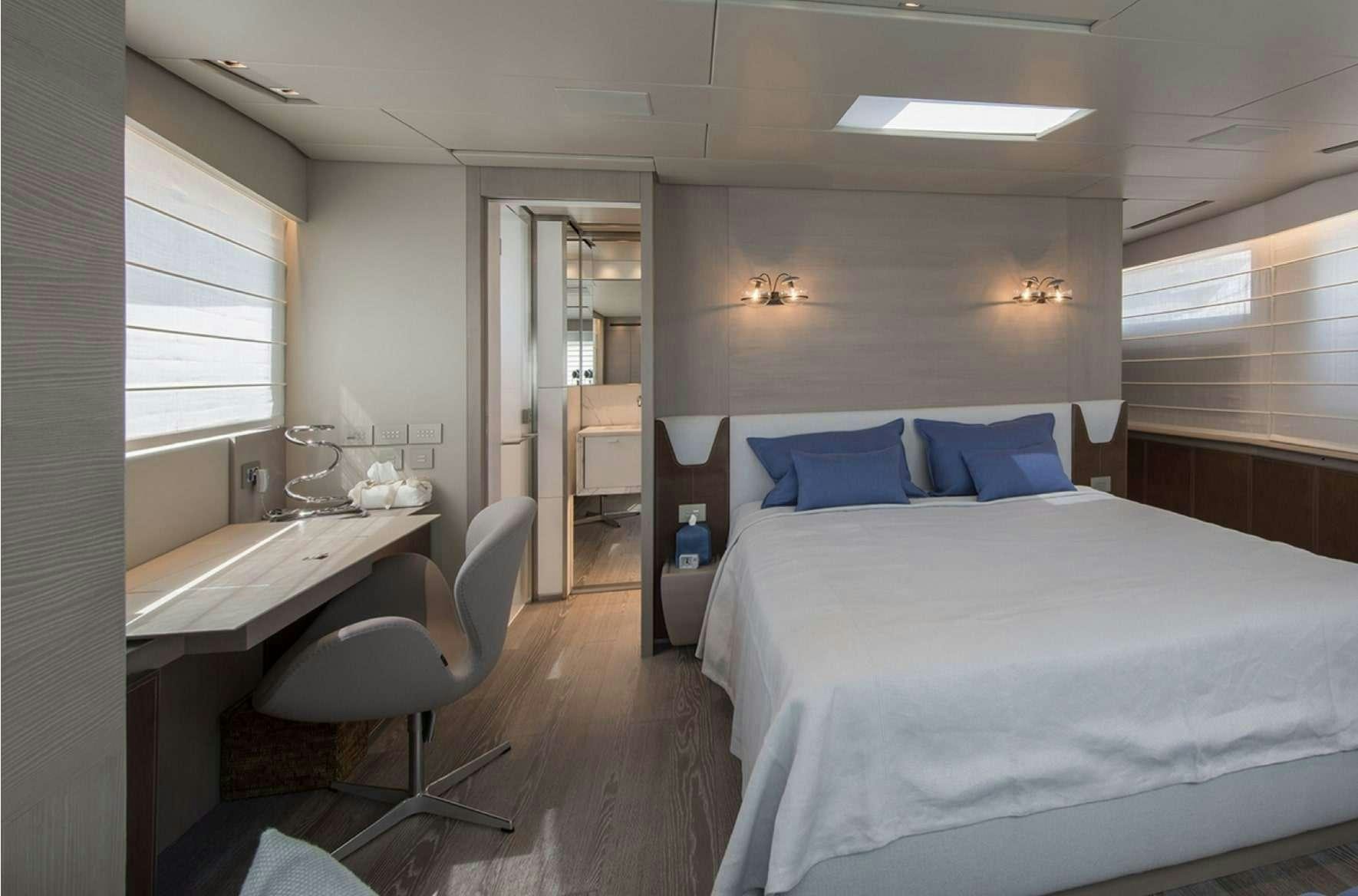 a room with a bed and a sink aboard ANDIAMO Yacht for Charter