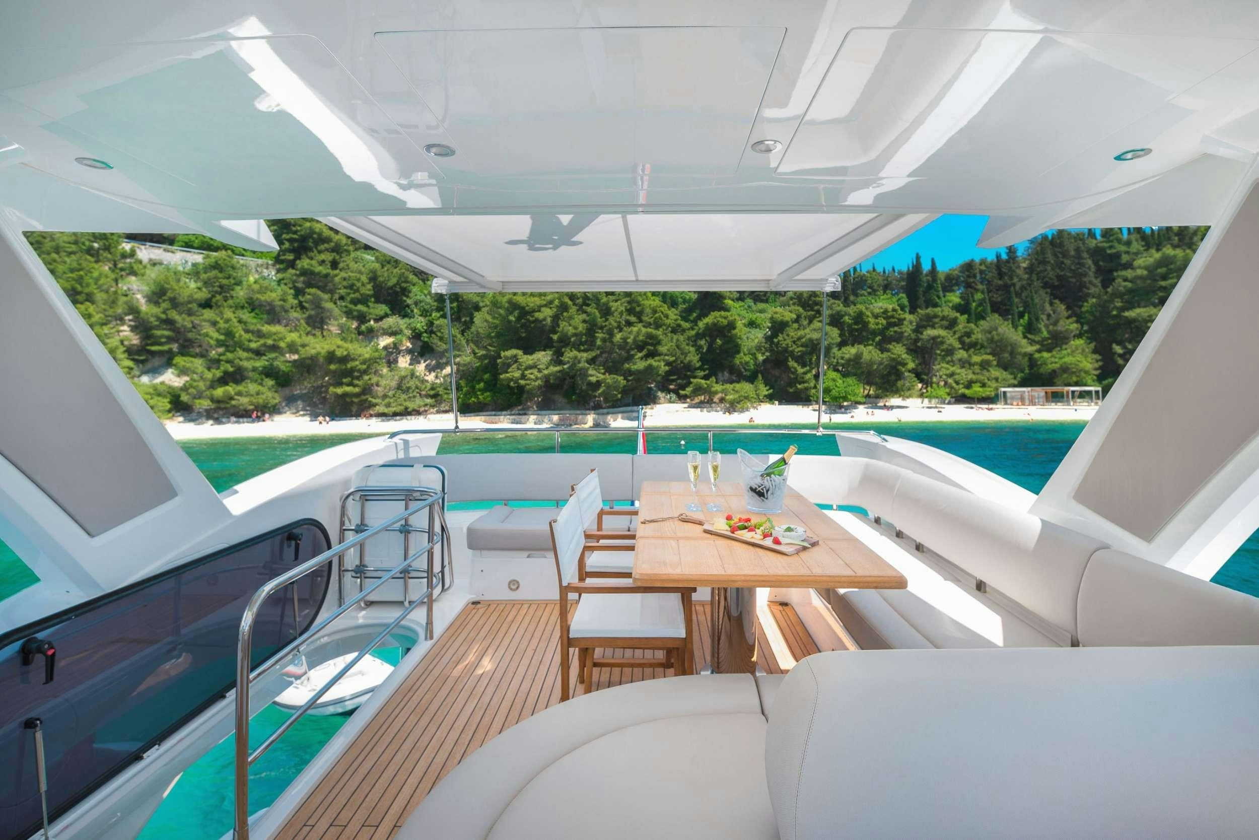 a pool with a table and chairs aboard HIDEAWAY Yacht for Charter