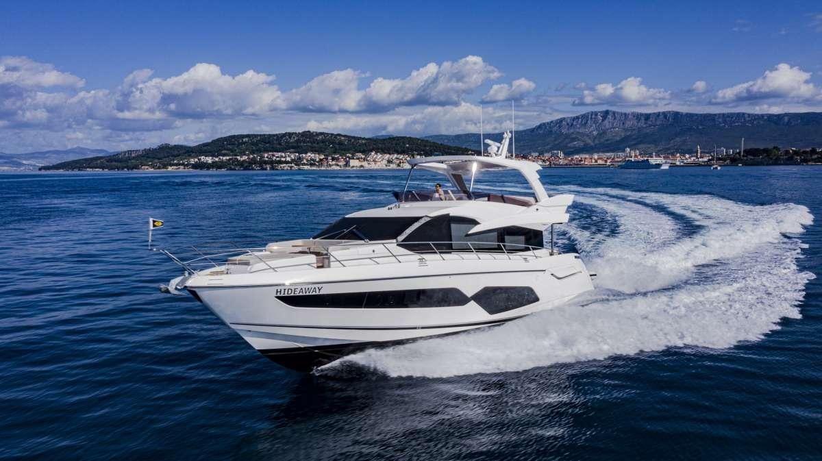 a white yacht on water aboard HIDEAWAY Yacht for Charter