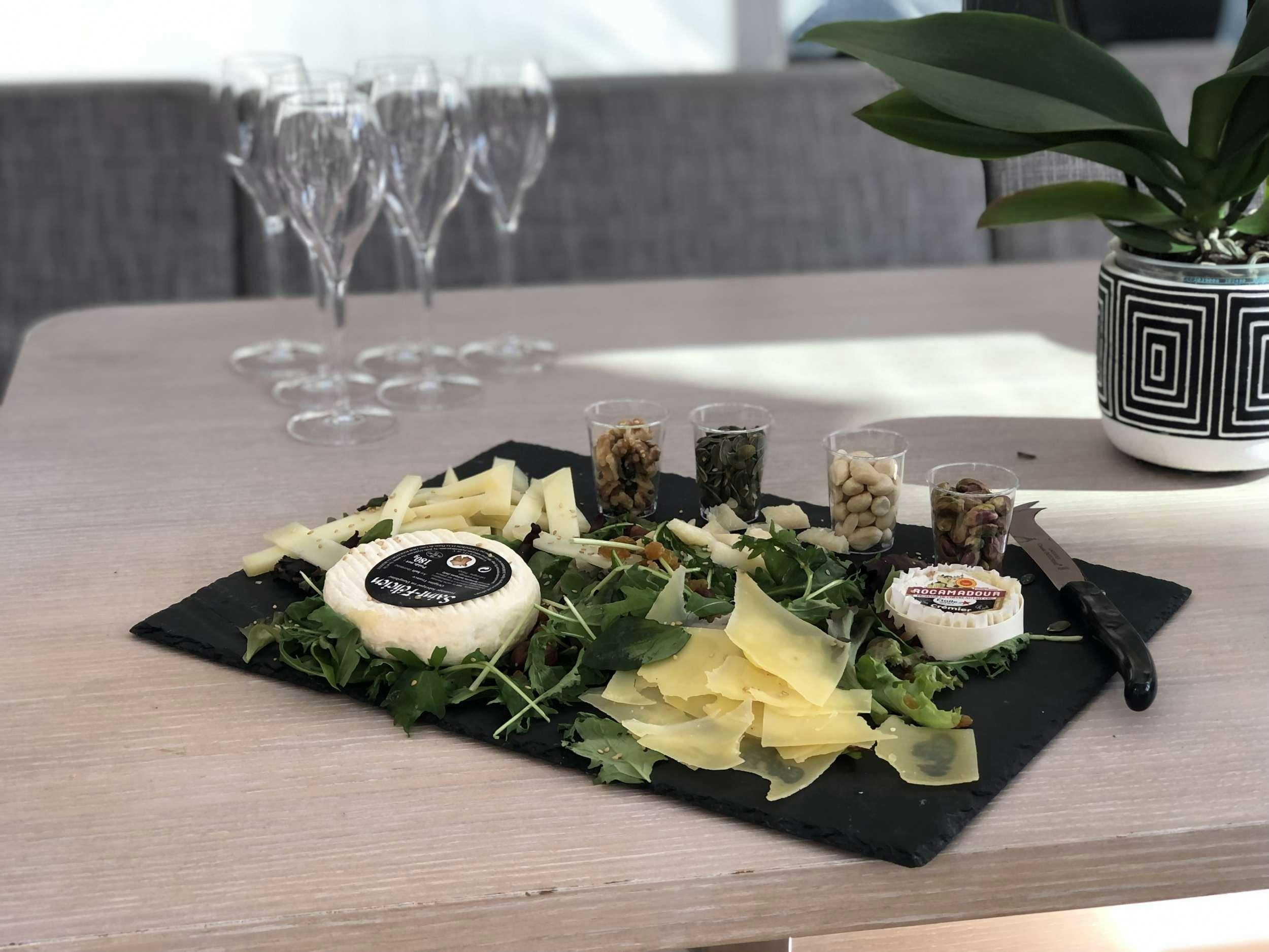 a plate of sushi and glasses aboard LUCE GUIDA Yacht for Charter