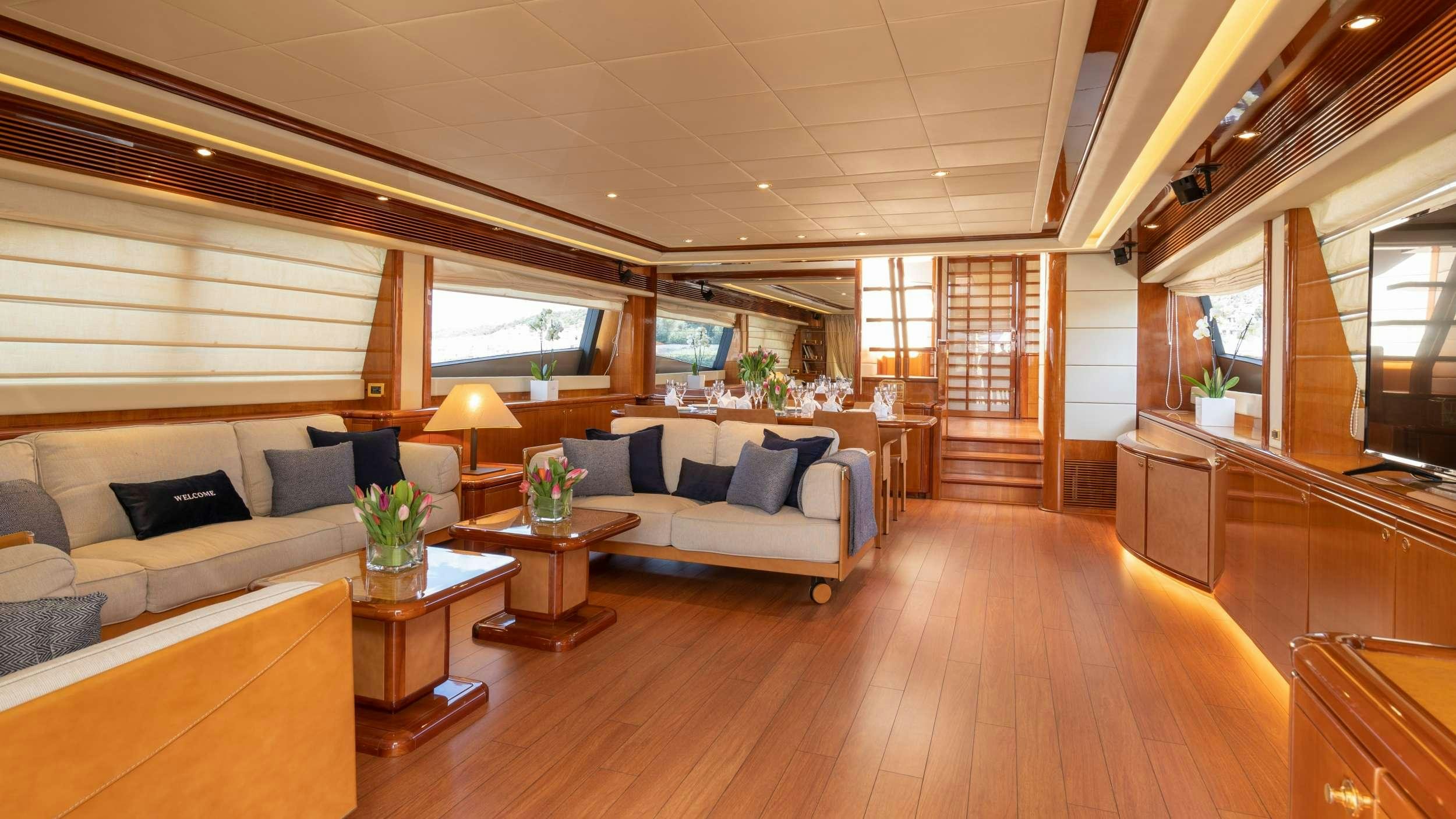 a living room with a wood floor aboard ESTIA YI Yacht for Charter