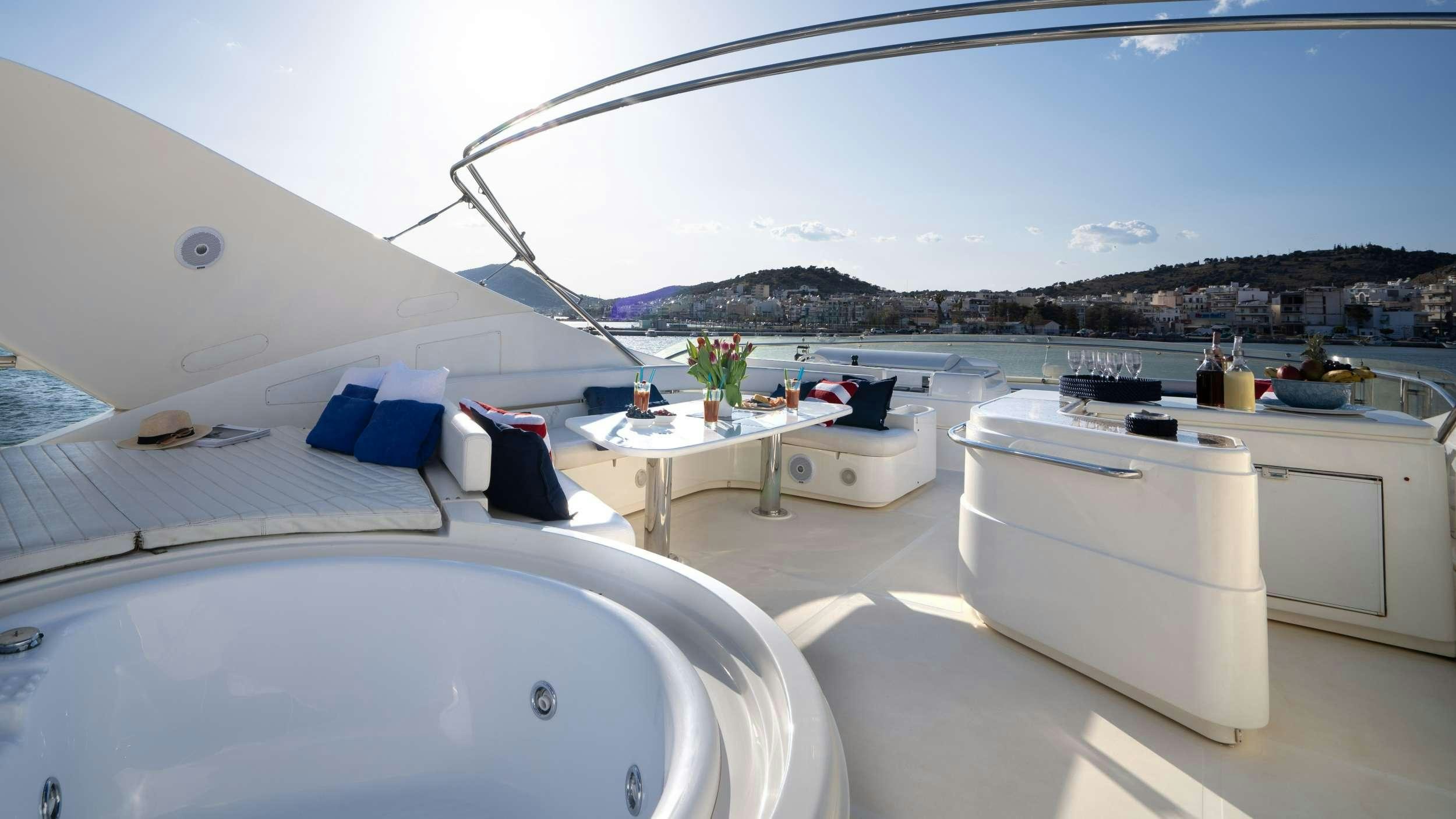 a room with a table and chairs aboard ESTIA YI Yacht for Charter