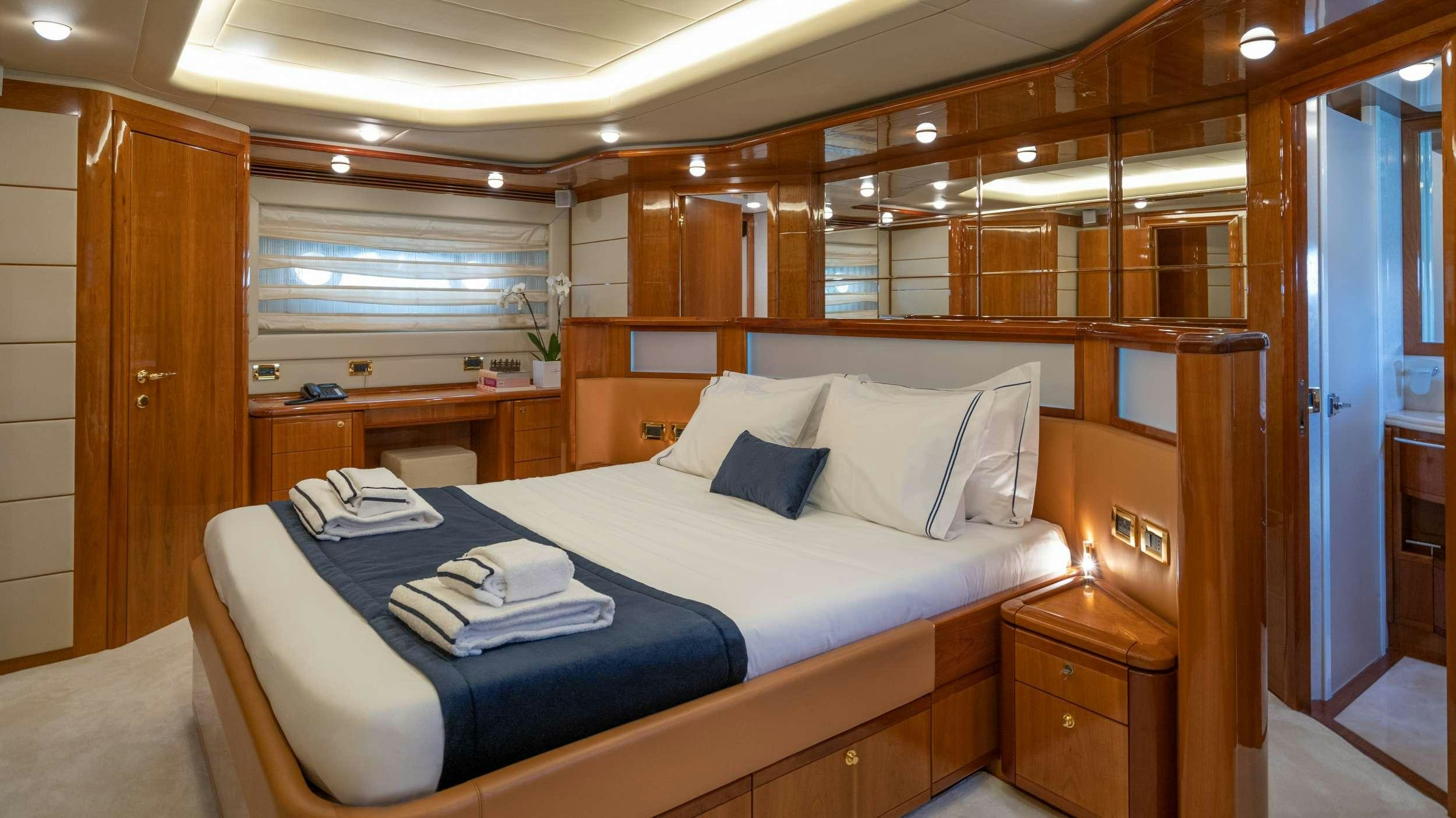 a bed in a room aboard ESTIA YI Yacht for Charter